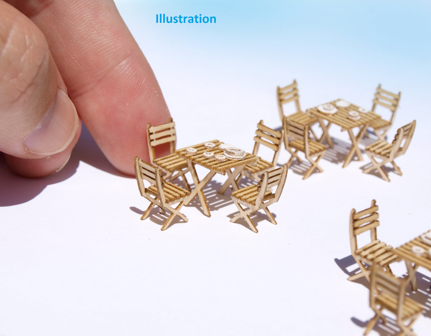 naaron88 ho scale miniature french cafe tables and chairs. Precisely laser cut DIY kits. Unbuilt and unpainted. Perfect for 1/87 dioramas and model scenes.